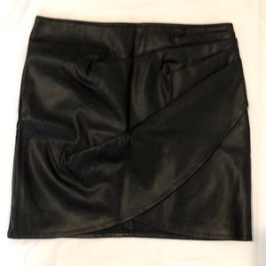The Brand is Shinestar, Black Mini Skirt, Large, 70% Polyurethane 30% Polyester.